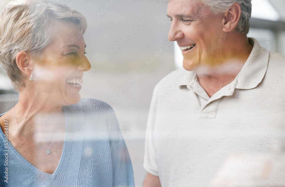 Senior, couple and happy love of woman and a man laughing together in retirement. Elderly people enjoy a funny conversation with happiness, joy and life gratitude smile in a house speaking Senior, couple and happy love of woman and a man laughing together in retirement. Elderly people enjoy a funny conversation with happiness, joy and life gratitude smile in a house speaking