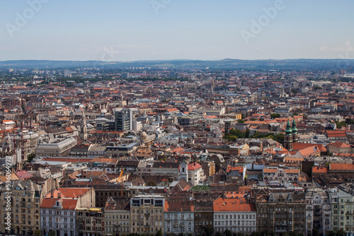 Skyline of Budapest, Hungary. Rooftop view from Gellert Hill. Buildings, old towers, and colorful cityscape. Historical downtown neighborhood, Hungarian urban landscape.