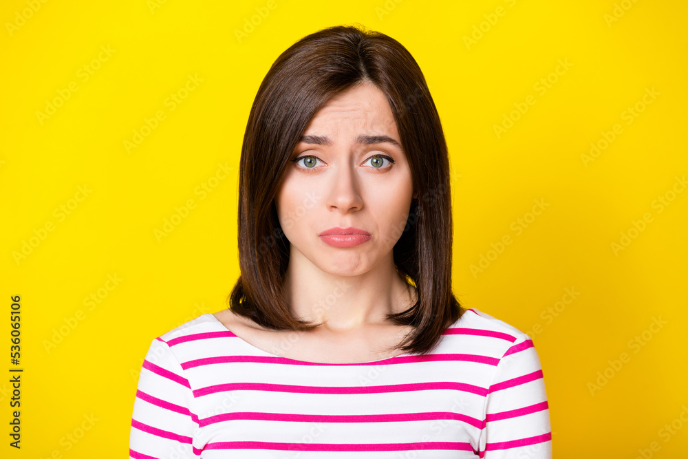Closeup photo of young sad attractive girl looking directly you will cry bad mood problems isolated on yellow color background Closeup photo of young sad attractive girl looking directly you will cry bad mood problems isolated on yellow color background