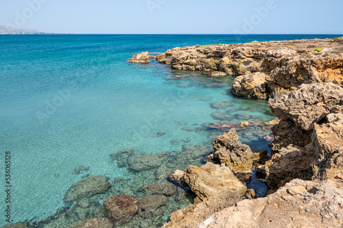 Small rocky beaches with clear and turquoise water in the natural oasis of Vendicari