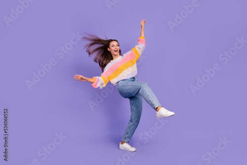 Full body photo of cheerful adorable person stand one leg rejoice isolated on violet color background