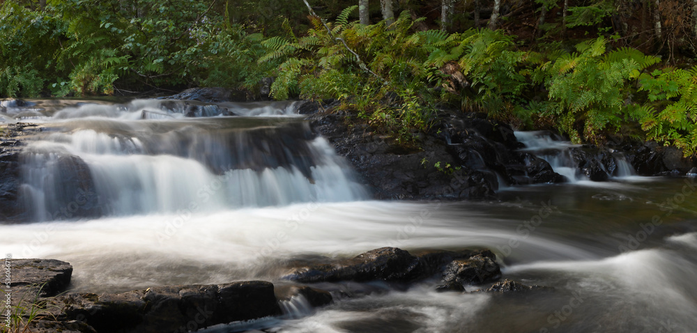 Fototapeta premium River in Maine running over boulders