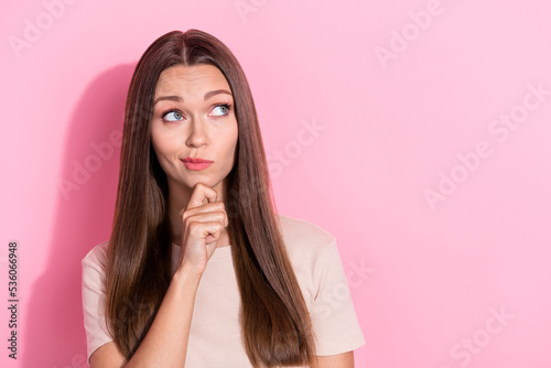 Closeup photo of young adorable funny dreamy smart woman minded look empty space touch chin offer unsure isolated on bright pink color background