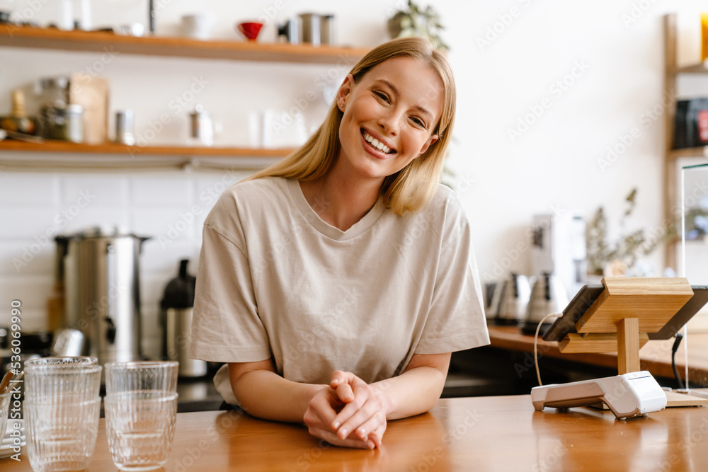 Young beautiful attractive long-haired smiling woman looking at camera Young beautiful attractive long-haired smiling woman looking at camera