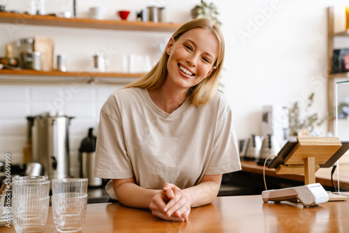 Young beautiful attractive long-haired smiling woman looking at camera