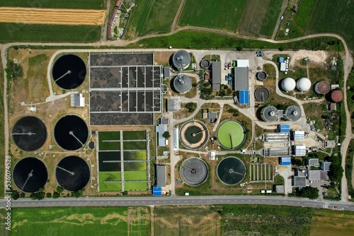 Aerial top down view of a water cleaning facility at city wastewater treatment plant