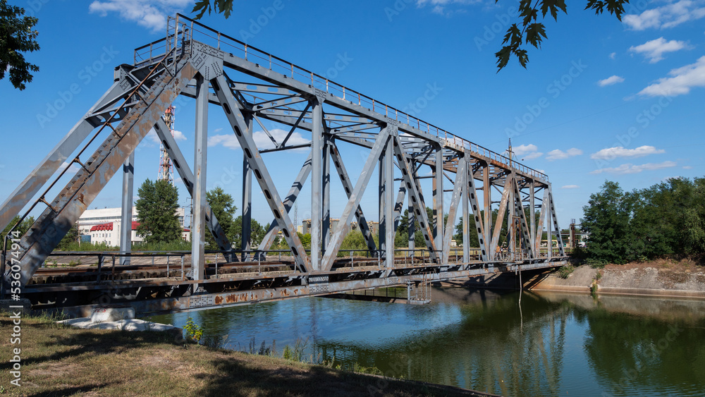 Railway bridge over the cooling pond of the Chernobyl nuclear power plant. Radiation, radioactive. Exclusion Zone. Ukraine. Pripyat