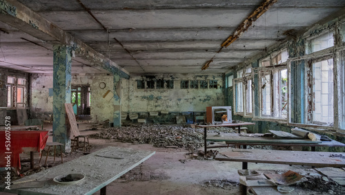 Inside destroyed abandoned building canteen in ghost city Pripyat after explosion fourth reactor Chernobyl nuclear power plant. Ukraine. Radiation, catastrophe