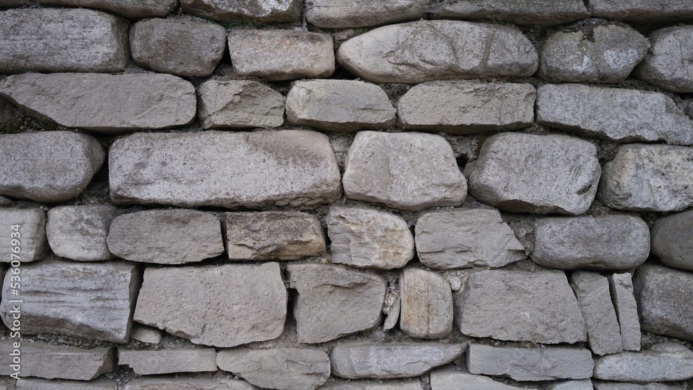 Fototapeta premium Stone old wall fencing seamless texture closeup