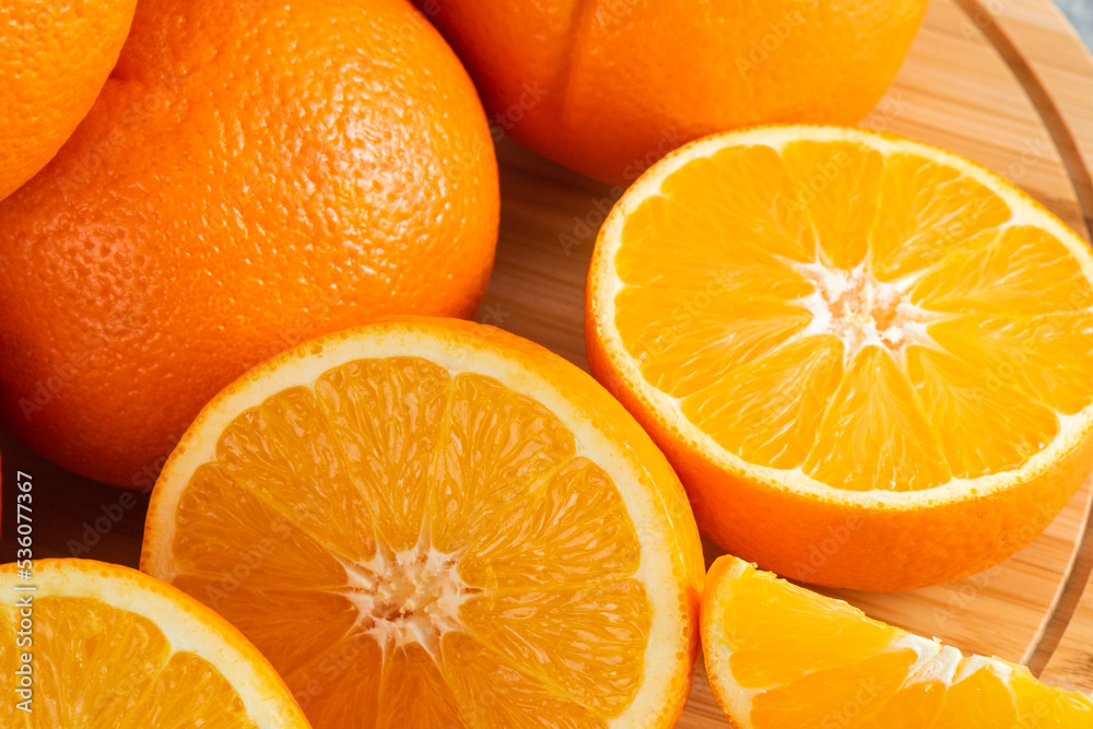 front view fresh sliced orange on dark background ripe mellow fruit juice color citrus tree citrus, Whole and sliced ripe oranges placed on marble background, half orange fruit. front view fresh sliced orange on dark background ripe mellow fruit juice color citrus tree citrus, Whole and sliced ripe oranges placed on marble background, half orange fruit.