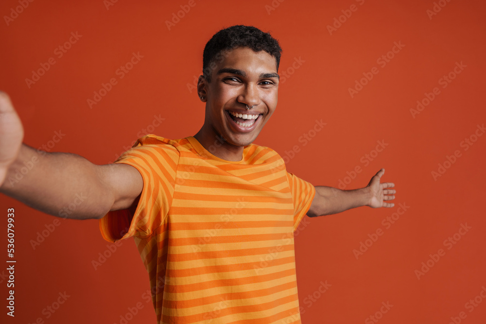 Selfportrait of young handsome smiling happy african man in t-shirt Selfportrait of young handsome smiling happy african man in t-shirt