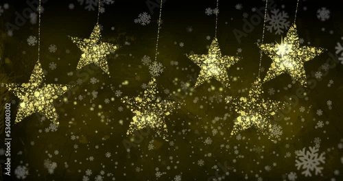 Wallpaper Mural Animation of snowflakes floating over golden stars on black background Torontodigital.ca