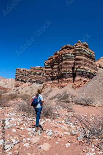 Woman walking in the colourfull mountain