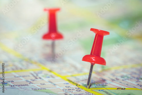 Thumbtacks on a roadmap