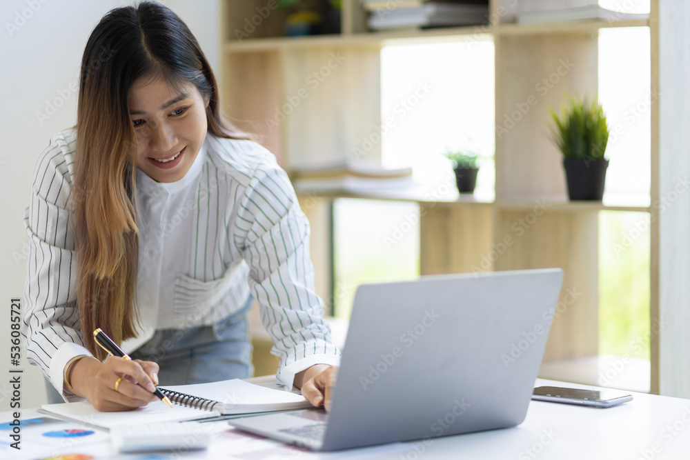 Businesswoman in the office working on business financial reports analyzing company financial statistics and making accounting. Businesswoman in the office working on business financial reports analyzing company financial statistics and making accounting.
