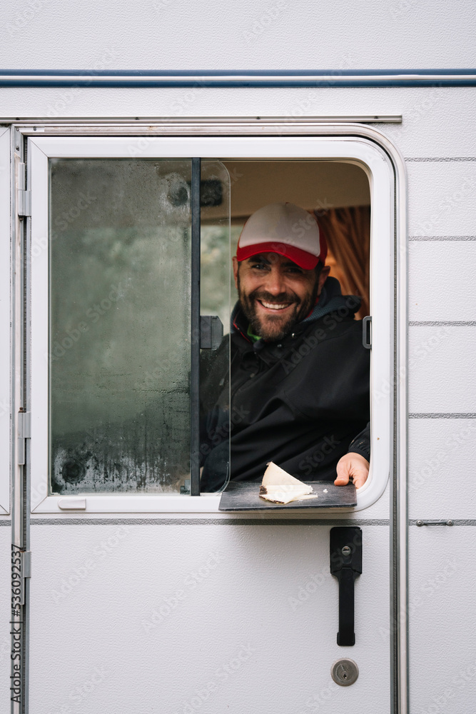 Bearded driver peeping out of front seat of truck Bearded driver peeping out of front seat of truck