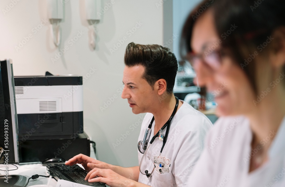 Doctor working at computer Doctor working at computer