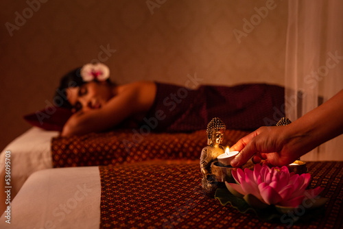 Thai woman decorating massage salon