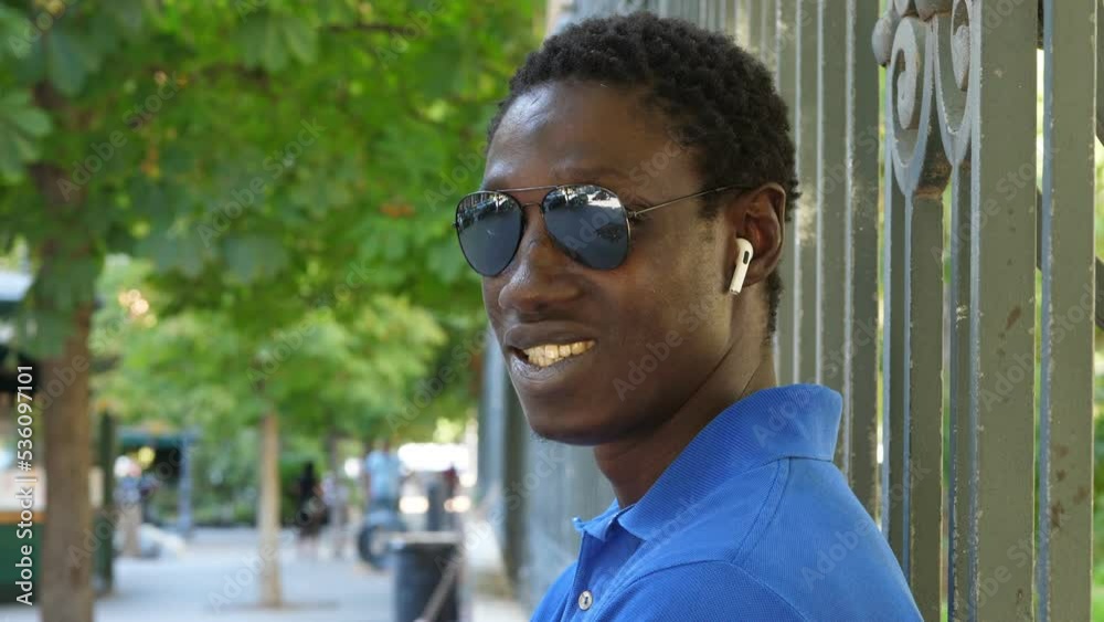 Attractive proud young african man smiling at camera Attractive proud young african man smiling at camera