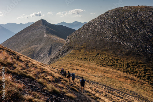 Backpackers walking through mountainous area