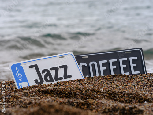 Photography coffee and  jazz sign on the beach