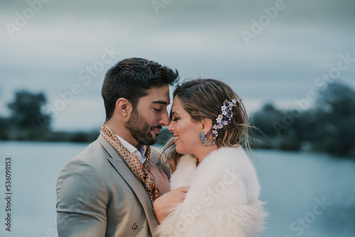 Man kissing and hugging with woman