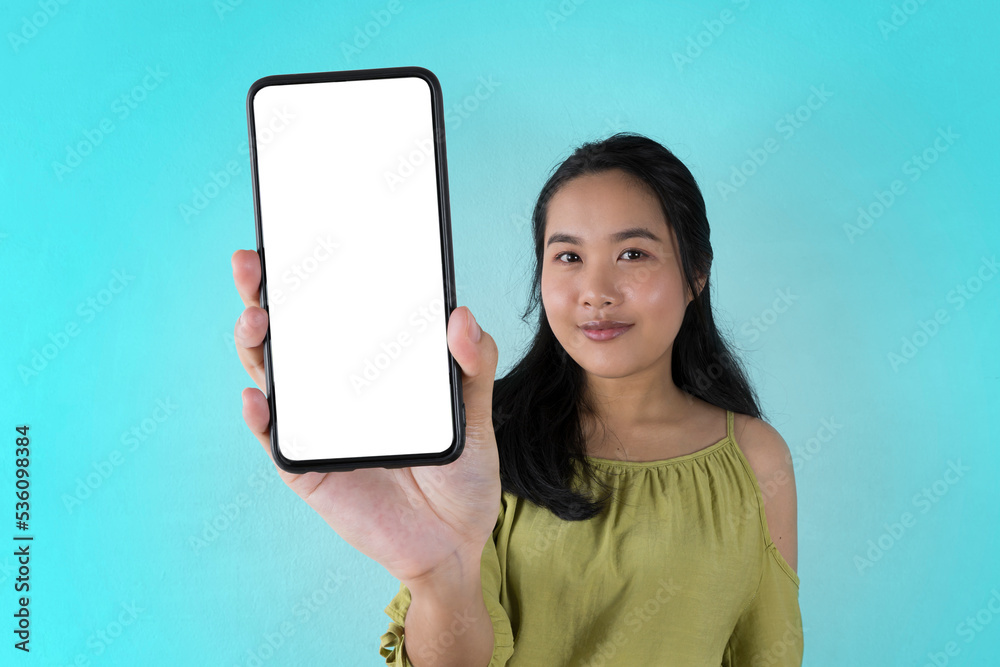 Trendy Mobile Phone. Excited cute Asian woman holding a smartphone with a blank white screen showing Trendy Mobile Phone. Excited cute Asian woman holding a smartphone with a blank white screen showing