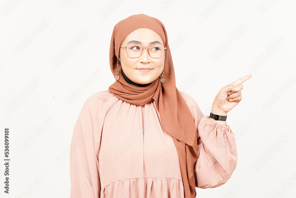 Showing Product and Pointing Side of Beautiful Asian Woman Wearing Hijab Isolated On White Showing Product and Pointing Side of Beautiful Asian Woman Wearing Hijab Isolated On White