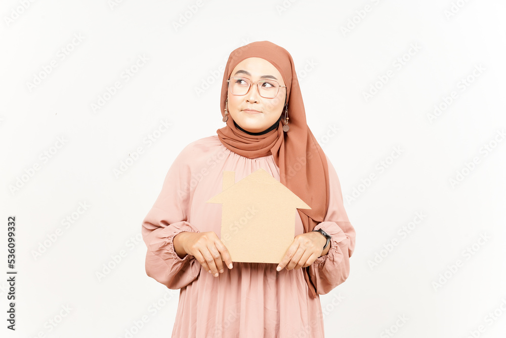 Thinking and Holding Cutout House of Beautiful Asian Woman Wearing Hijab Isolated On White
