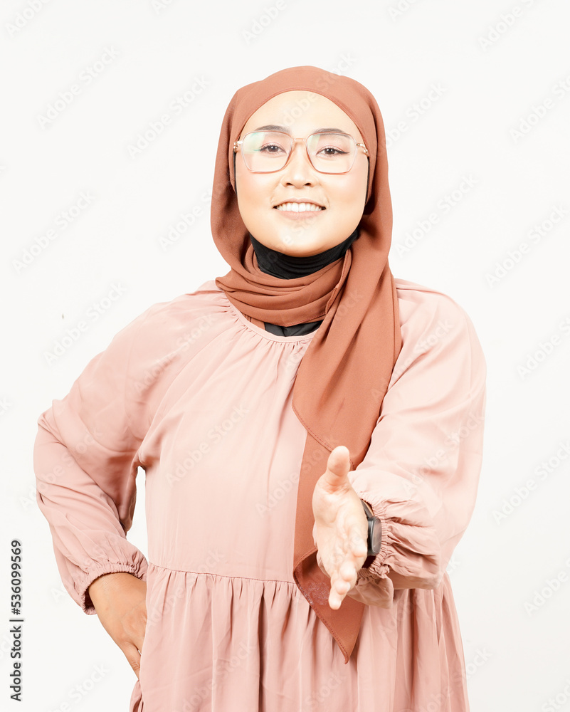 Offering Shake hand of Beautiful Asian Woman Wearing Hijab Isolated On White Background Offering Shake hand of Beautiful Asian Woman Wearing Hijab Isolated On White Background