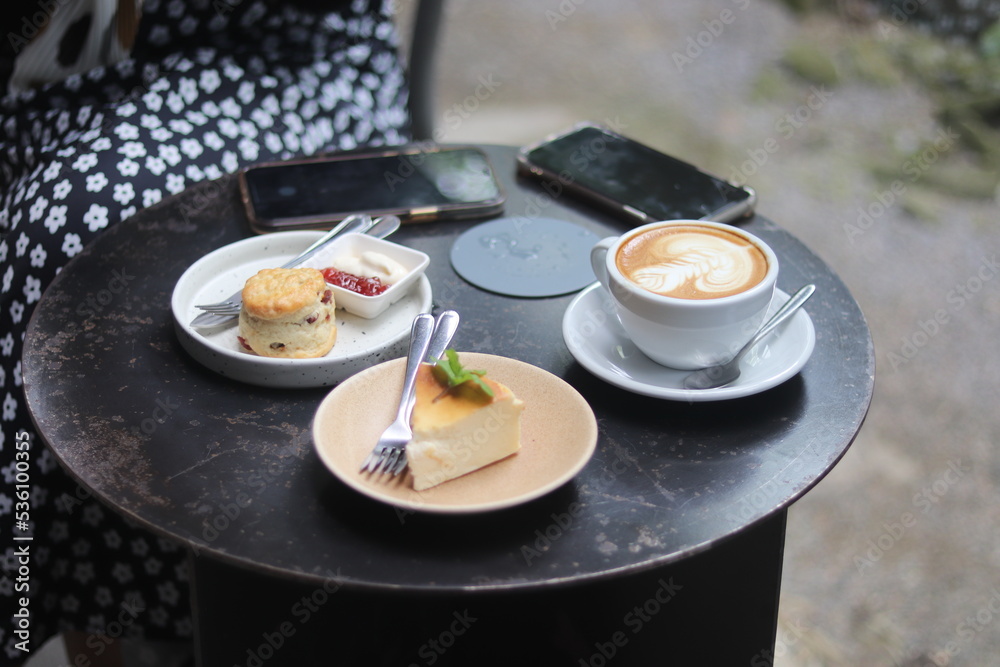 A cup of latte art and bakery on the table A cup of latte art and bakery on the table