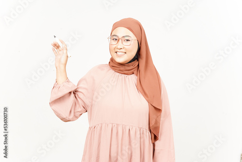 Holding marker teaching concept of Beautiful Asian Woman Wearing Hijab Isolated On White Background © Sino Images Studio