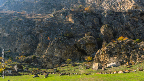 The city of the dead in North Ossetia. An ancient necropolis high in the mountains. A complex of ground and semi-underground structures-crypts. Ancient stone buildings in an ancient city. Ancient city