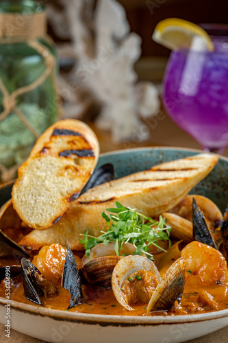 Cioppino with Gulf Shrimp, Bay Scallop, Clams, P.E.I. Mussels, Gulf Fish, Florida Orange Peel, Tomato Chardonnay Broth and Grilled Baguette