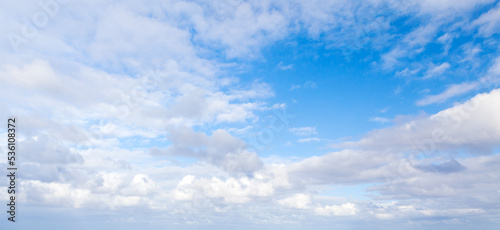 Blue sky with white altocumulus clouds on a daytime