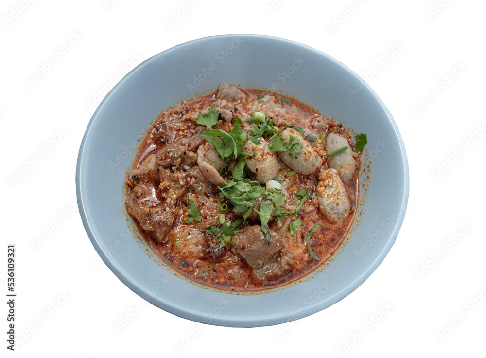 Spicy tom yum rice stick noodles (Thai spicy soup) with braised pork (stewed pork), fresh pork and pork balls sprinkled with coriander in bowl isolated on white background with clipping path. Selectiv Spicy tom yum rice stick noodles (Thai spicy soup) with braised pork (stewed pork), fresh pork and pork balls sprinkled with coriander in bowl isolated on white background with clipping path. Selectiv