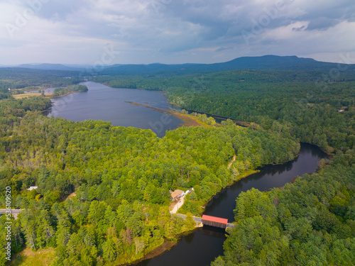 Hancock Greenfield Covered Bridge aerial view on Cantoocook River with Powder Mill Pond between town of Hancock and Greenfield in New Hampshire NH, USA.  photo