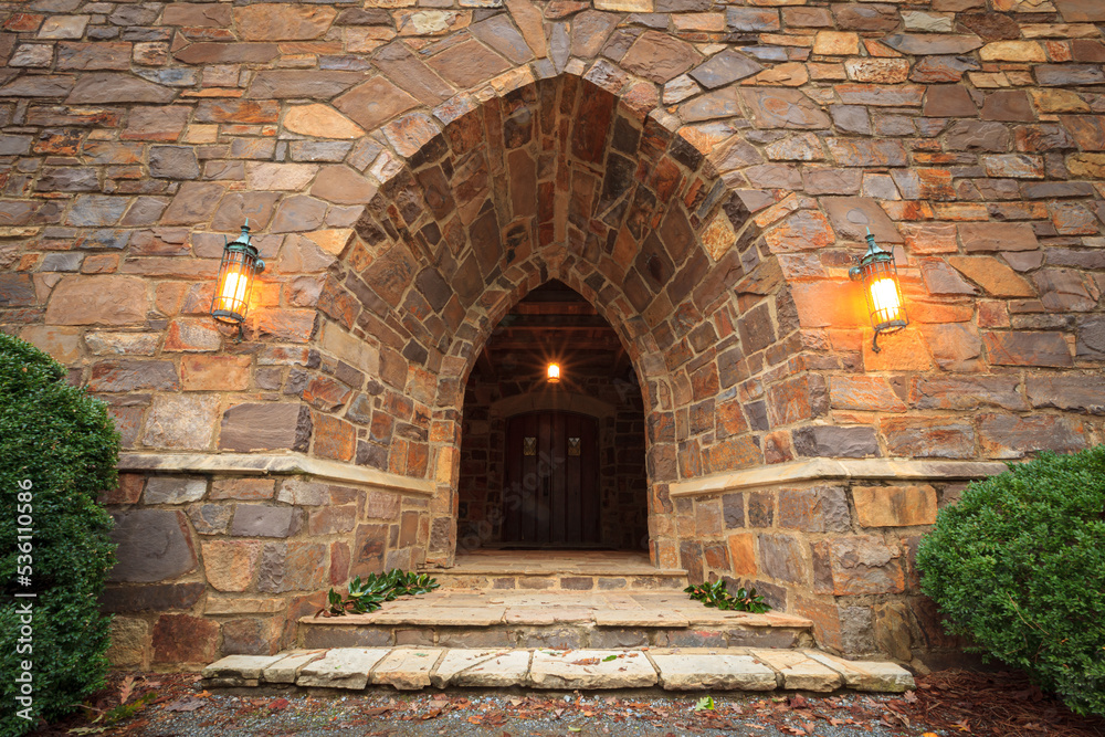 Castle archway entrance into dark interior