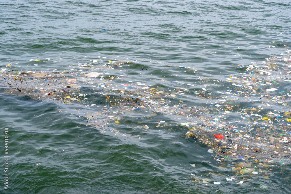 Express Package Pollution Garbage, waste, plastic packages and water surface pollution of the sea ...