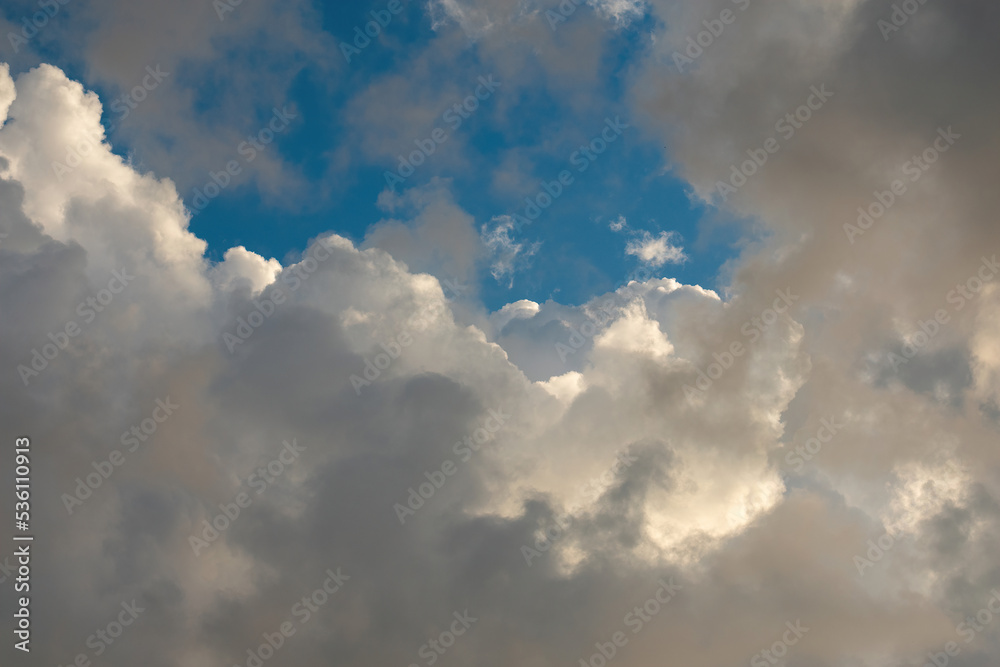 grandiosely Cumulus and cirrus cloudy dramatic gloomy sky before evening thunderstorm