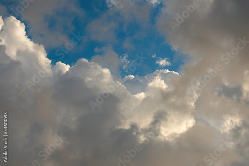 grandiosely Cumulus and cirrus cloudy dramatic gloomy sky before evening thunderstorm © welcomeinside