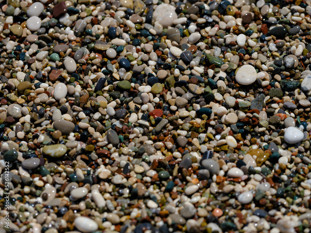 colorful pebbles on the beach colorful pebbles on the beach
