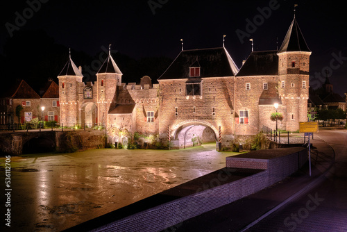 Amersfoort, The Netherlands, August 22, 2022. The Koppelpoort medieval gate and city walls against a night sky. photo