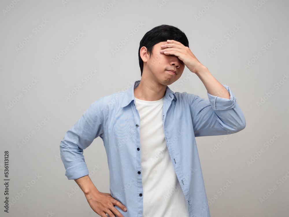 Worker man blue shirt hold his head feels dizzy isolated Worker man blue shirt hold his head feels dizzy isolated
