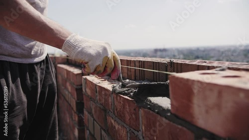 close-up of the builder hands, bricklaying photo