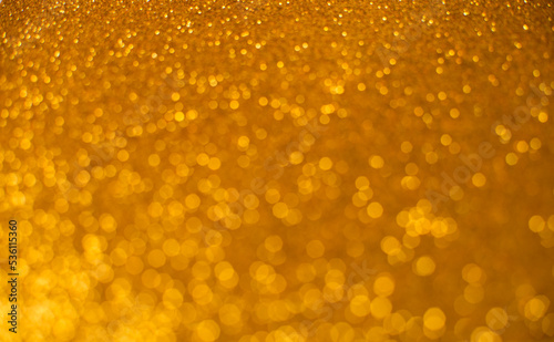 Golden abstract bokeh lights. defocalized background