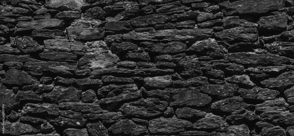 wide dark stone wall texture. Empty black stone wall background. wide dark stone wall texture. Empty black stone wall background.
