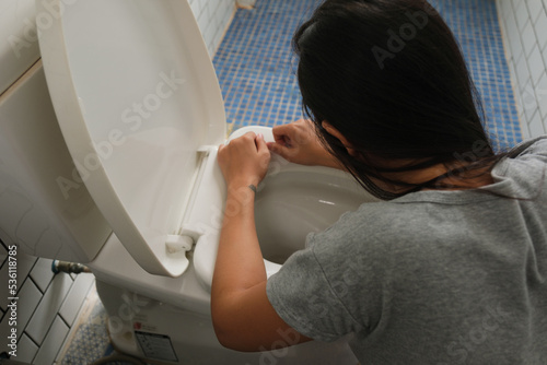 Woman drunk and vomit in bathroom
