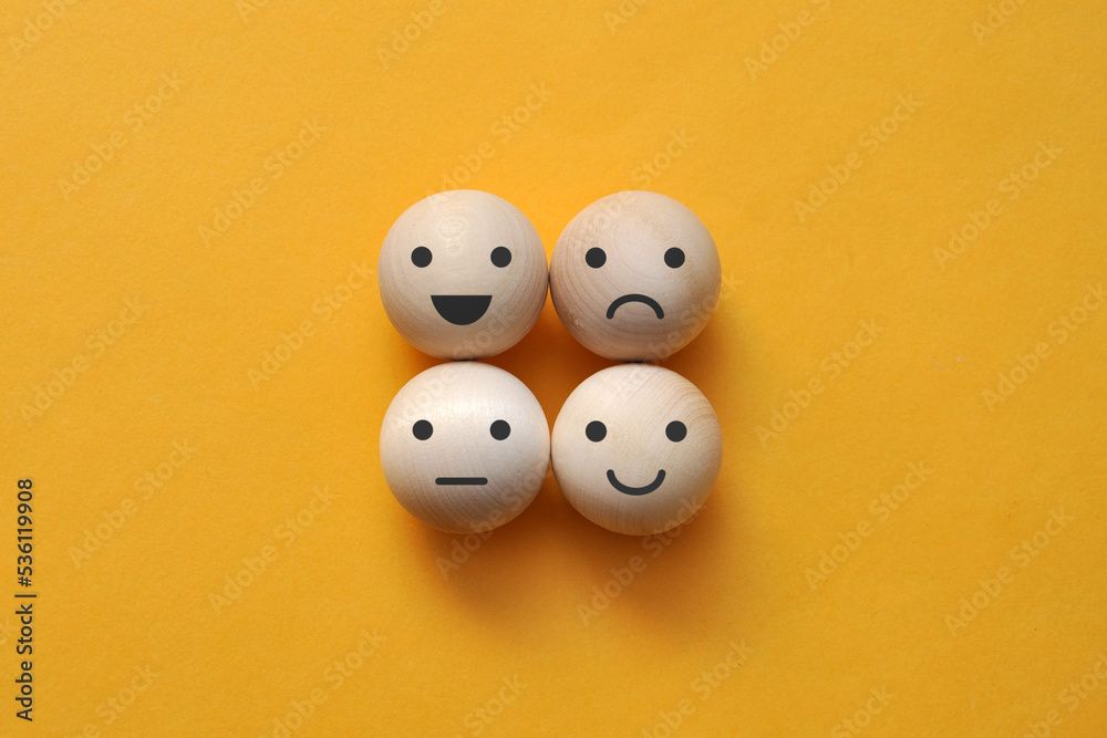 A variety of emotions: joy, serenity, anger, sadness wooden balls A variety of emotions: joy, serenity, anger, sadness wooden balls