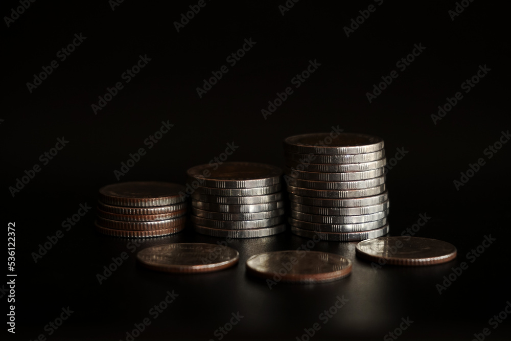Stack of coins on black background, Saving money concept Stack of coins on black background, Saving money concept